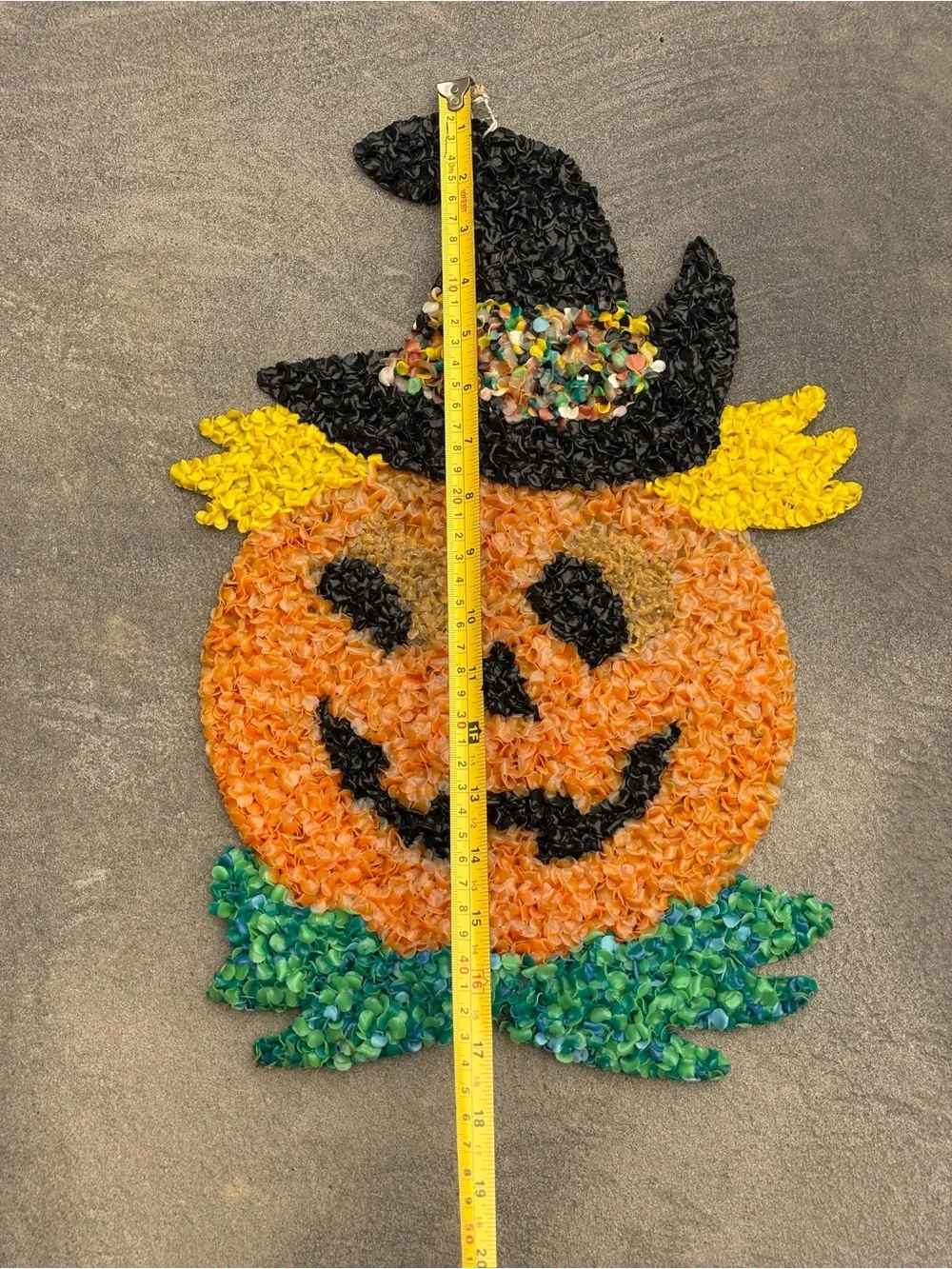 VTG melted plastic popcorn decoration features a jack-o'-lantern wearing a hat
